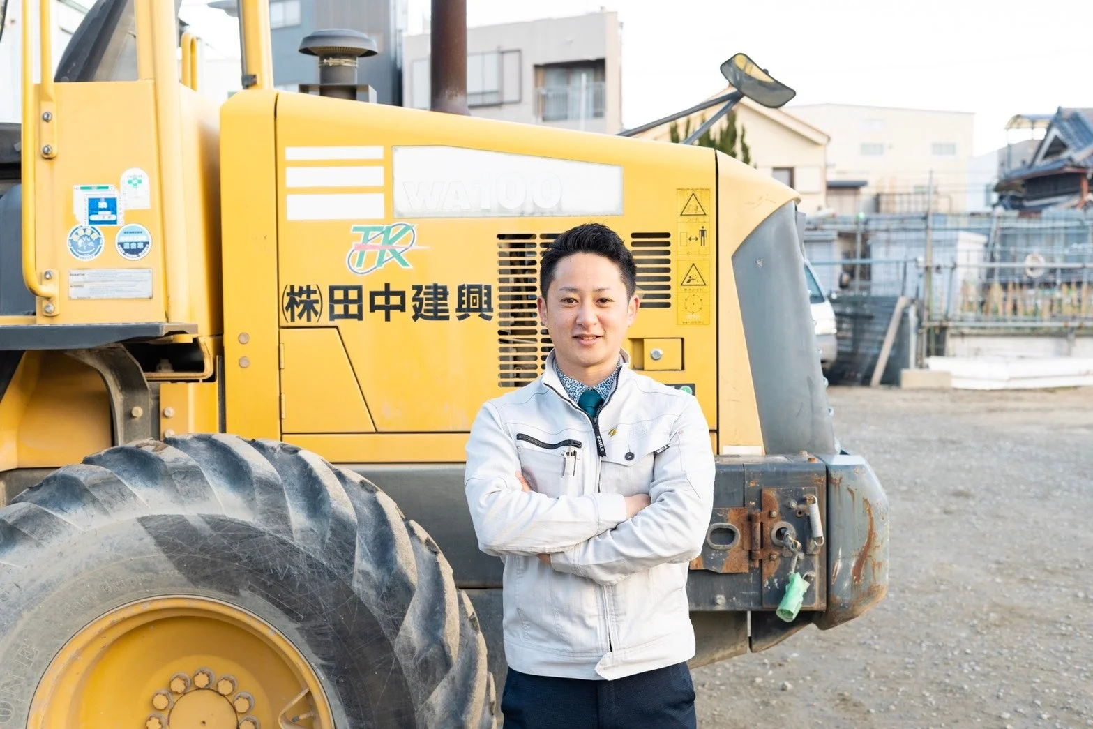 田中建興の作業着姿の男性