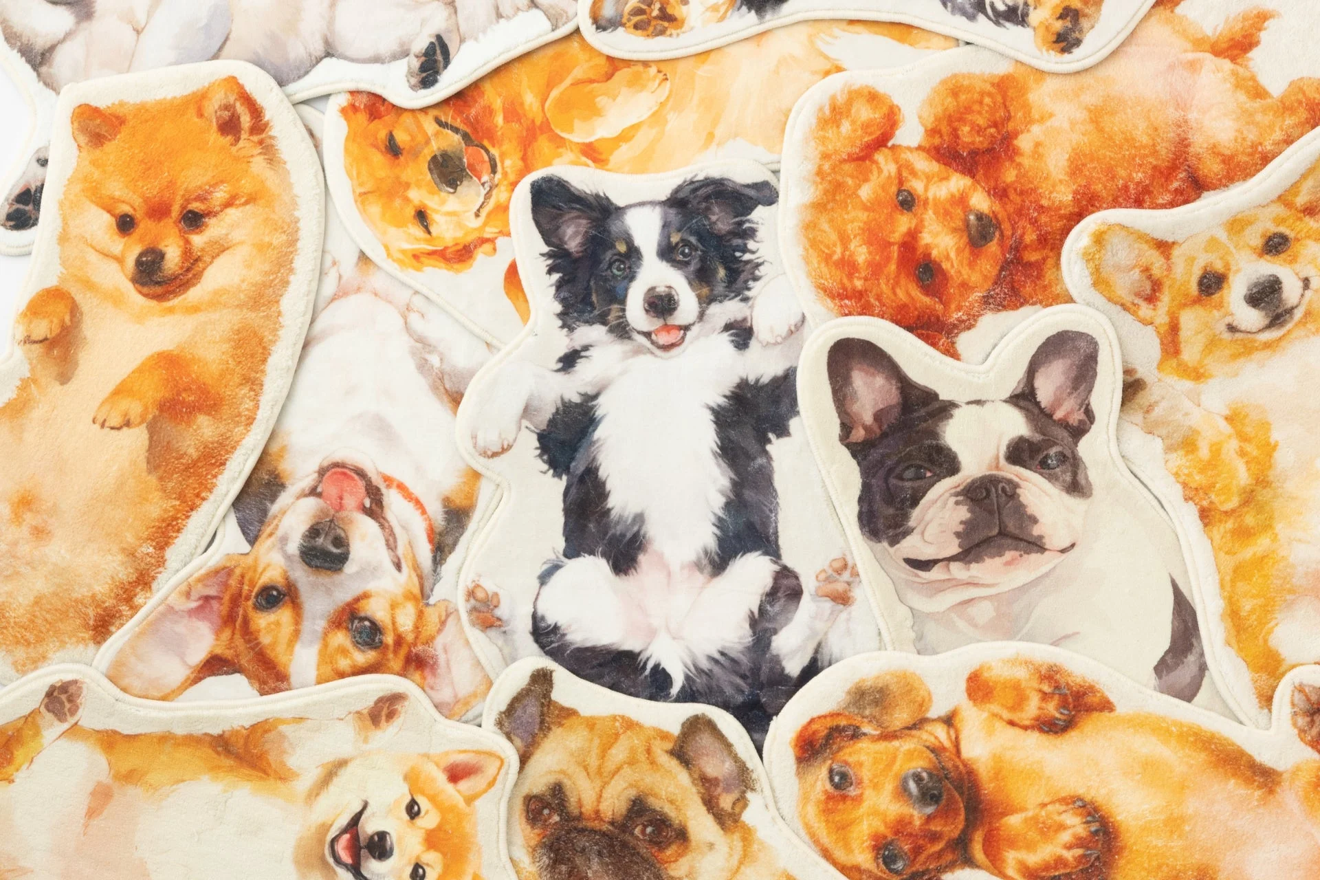 様々な犬種の可愛い子犬たちが描かれたイラストの集合